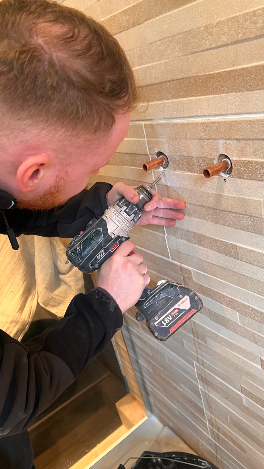 Plumber fitting pipework